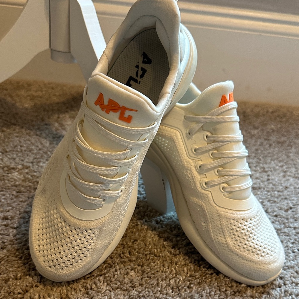 APL White Athletic Shoes with Orange Accents